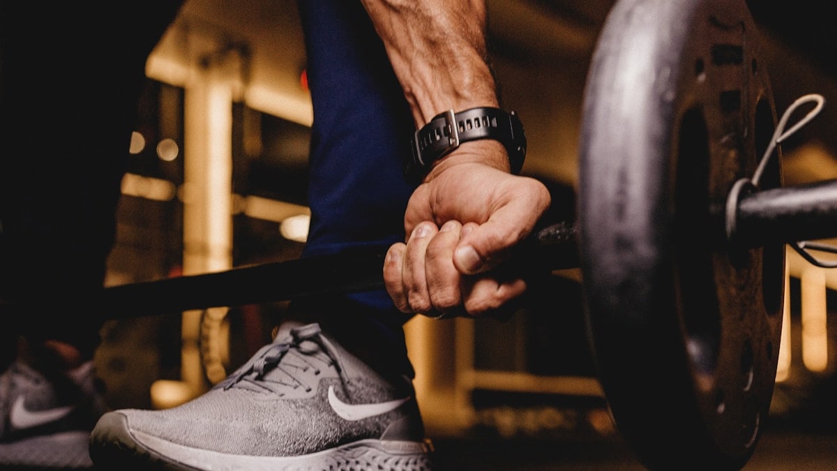 person about to lift barbell